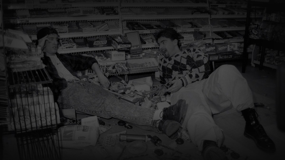 Still from Clerks (1994) — tmdb (pre-darkened 0.70, baked 32.4)