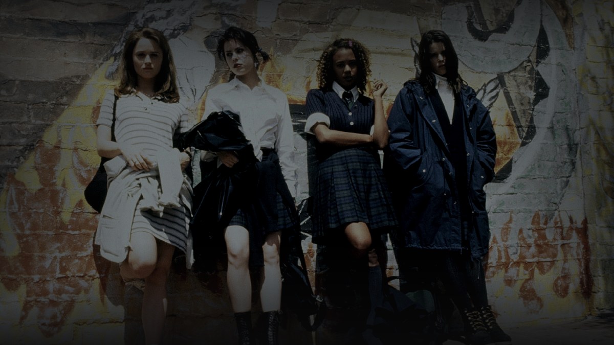 Still from The Craft (1996) — 16:9 still from Letterboxd (the 1200x675 crop variant), baked through scripts/bake_dark_photo.py at default factor 0.45, output brightness 42.9